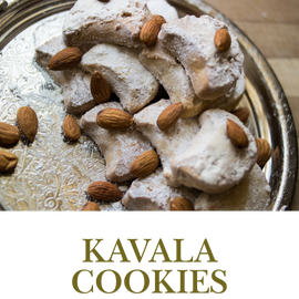 Kavala Cookies are buttery almond treats dusted with powdered sugar, offering a light sweetness and delightful crunch.