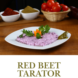 Red Beet Tarator is a delightful mix of grated beets, garlic, and yogurt, creating a creamy and colorful meze.